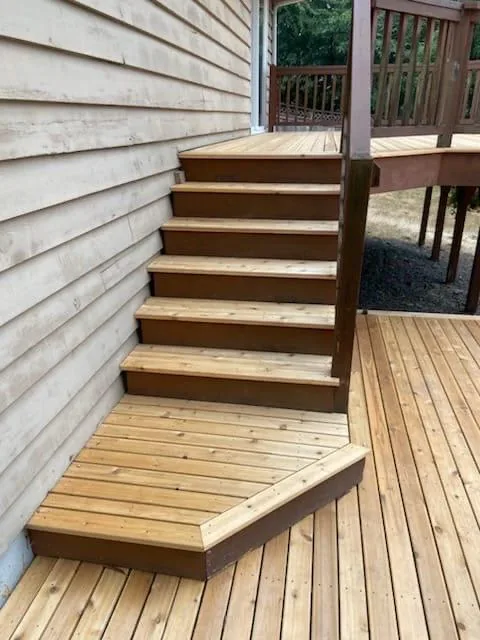 The wrapped step and stair treads joining the two deck levels