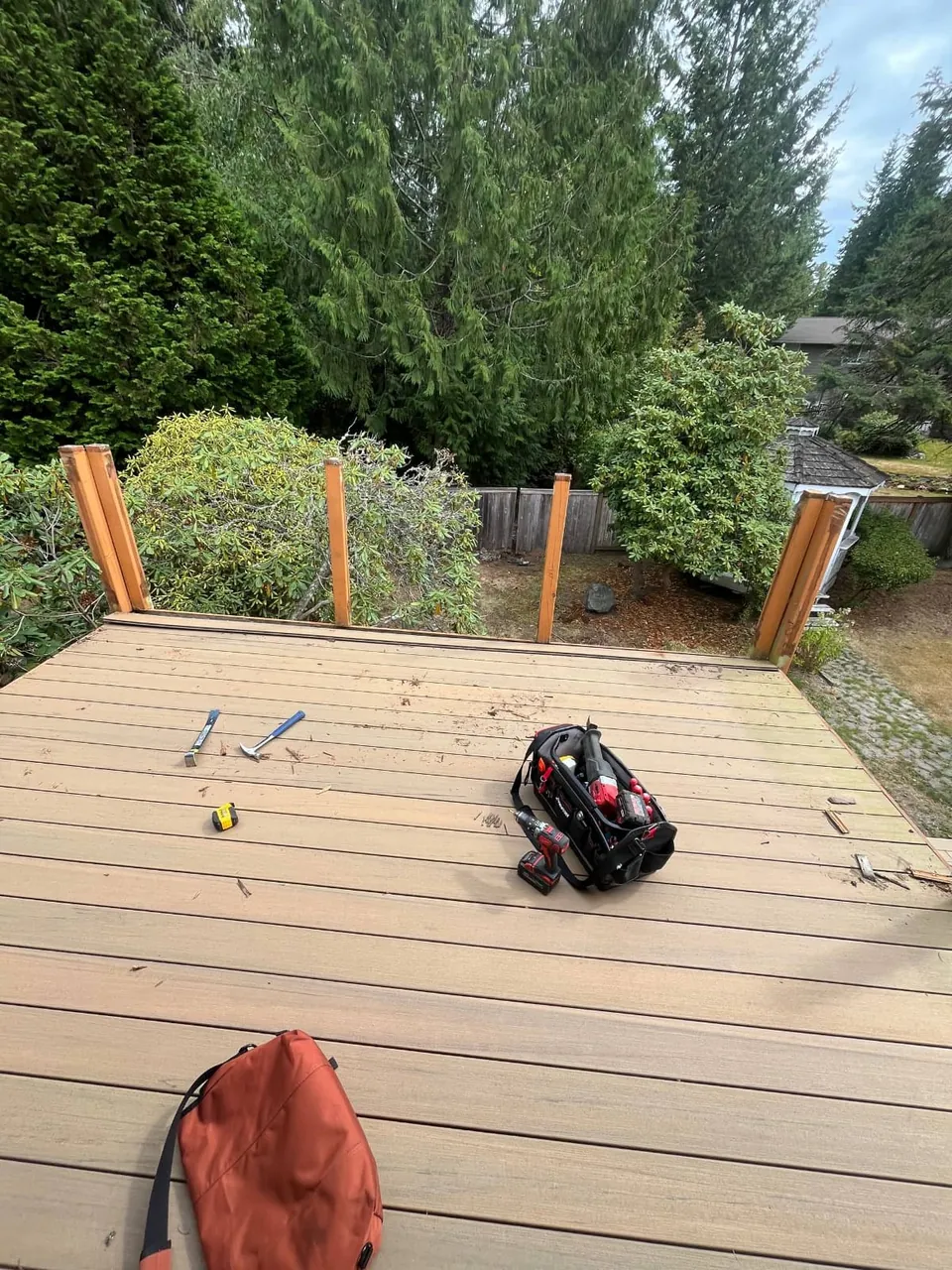 The deck with the old railing removed, only the corner posts standing