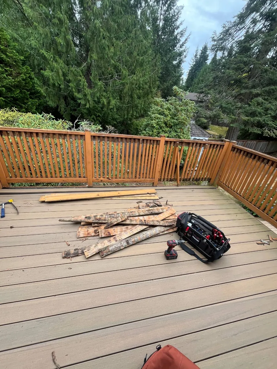 The new railing in place, offcuts and tools still on the deck boards