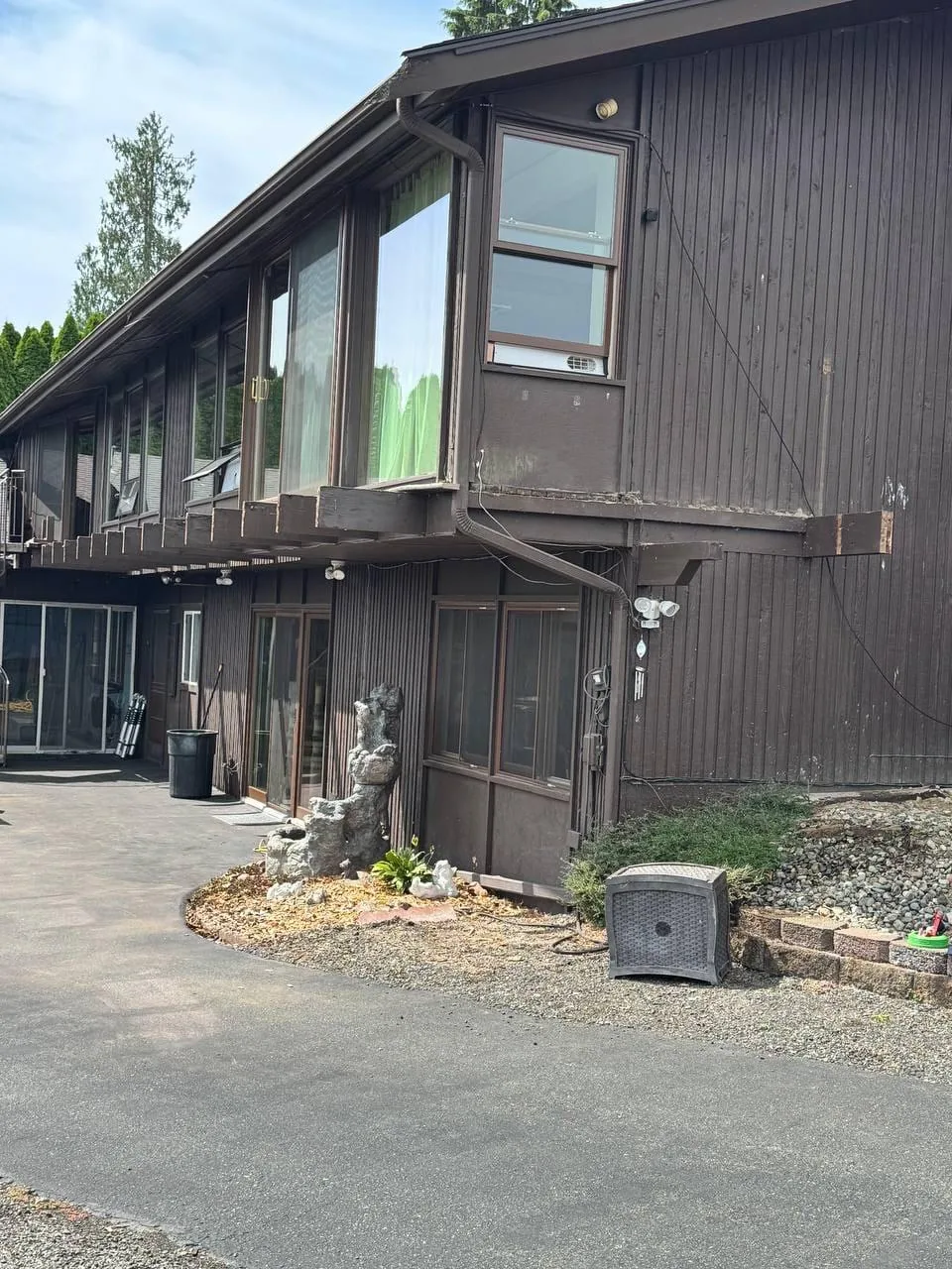 Second-storey balcony stripped back, railing removed and support beams exposed
