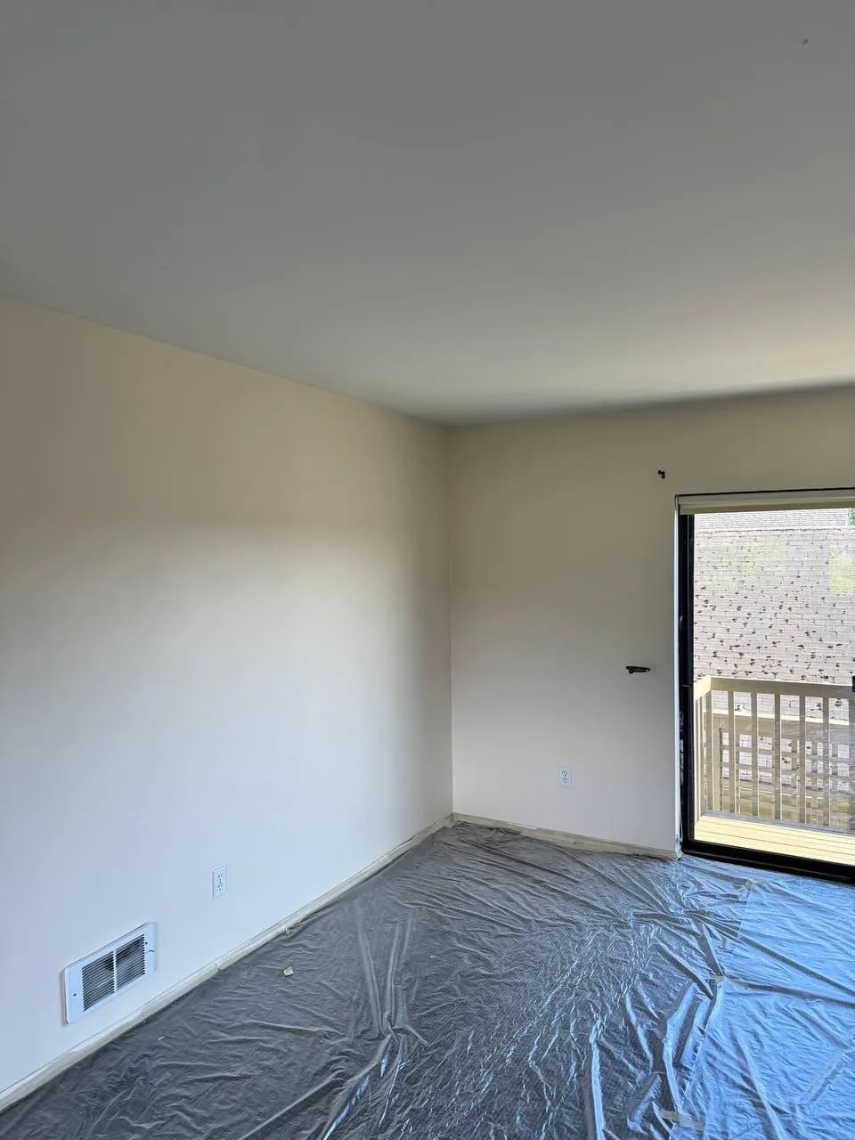The same room from the opposite corner, walls and ceiling finished