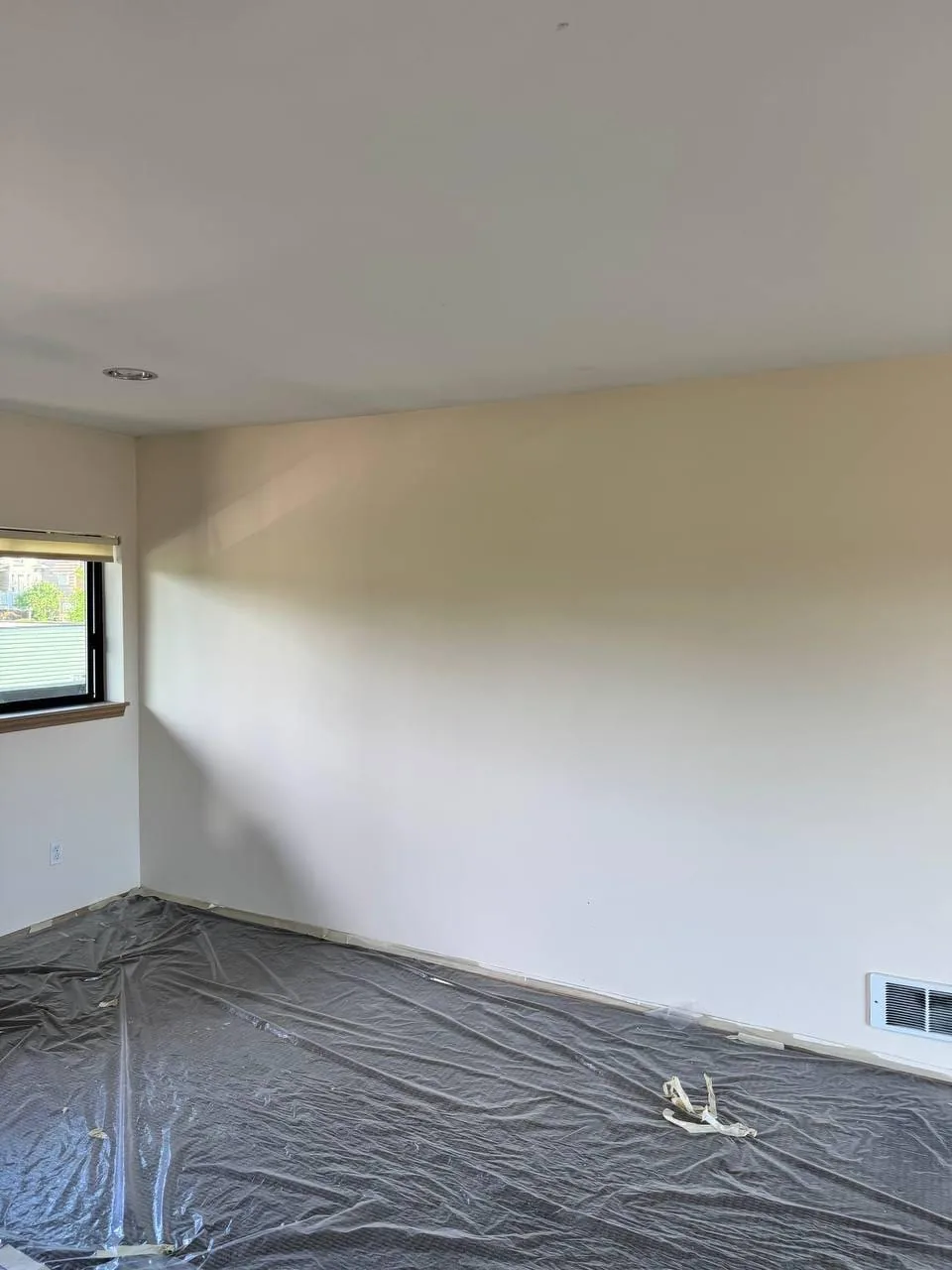 Another repainted room, sheeting still down over the floor