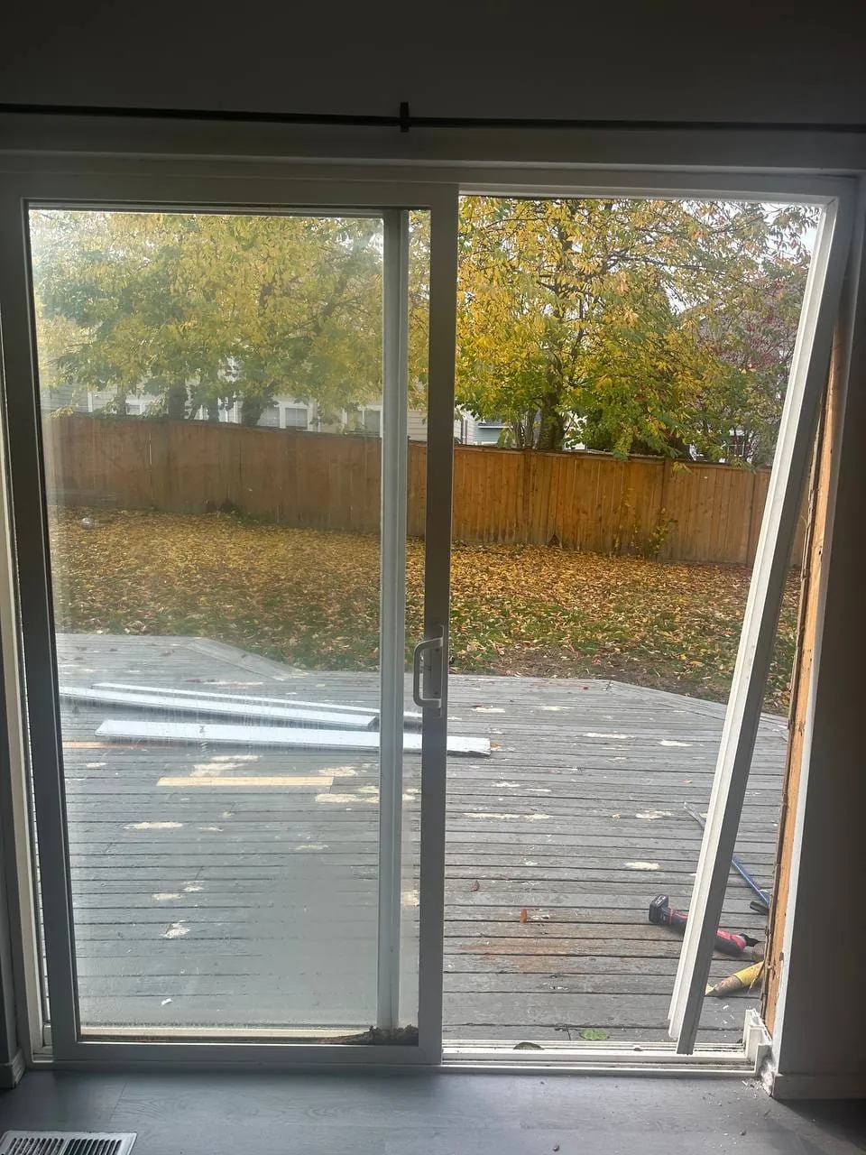 The old sliding patio door from inside, one panel out of its track