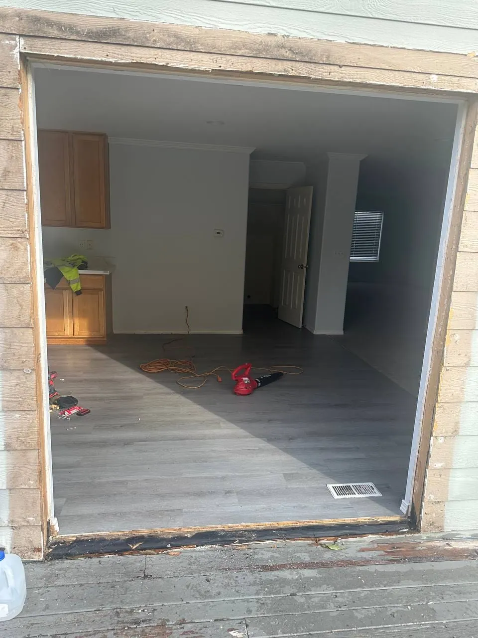 The empty rough opening in the wall with the door removed