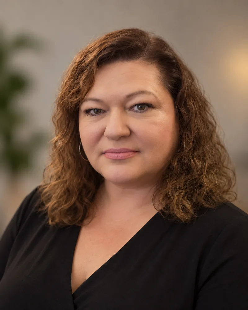 Olga, who answers the phone and books the schedule